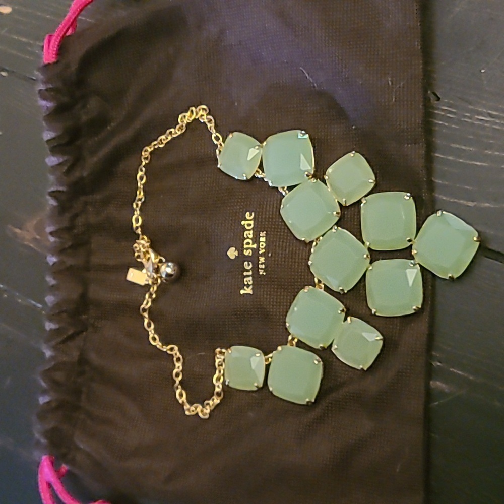 Gold and sea glass green necklace from Kate Spade. Never worn.